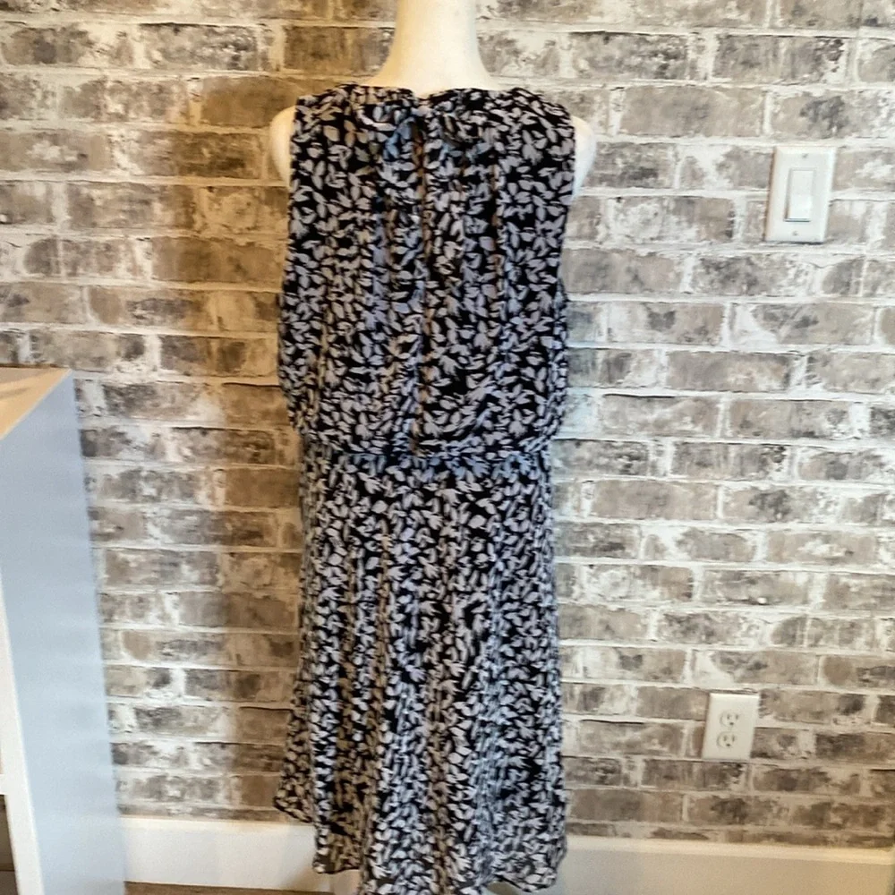 Karin Steven’s sleeveless black/white patterned lined dress. Tie at neck & waist